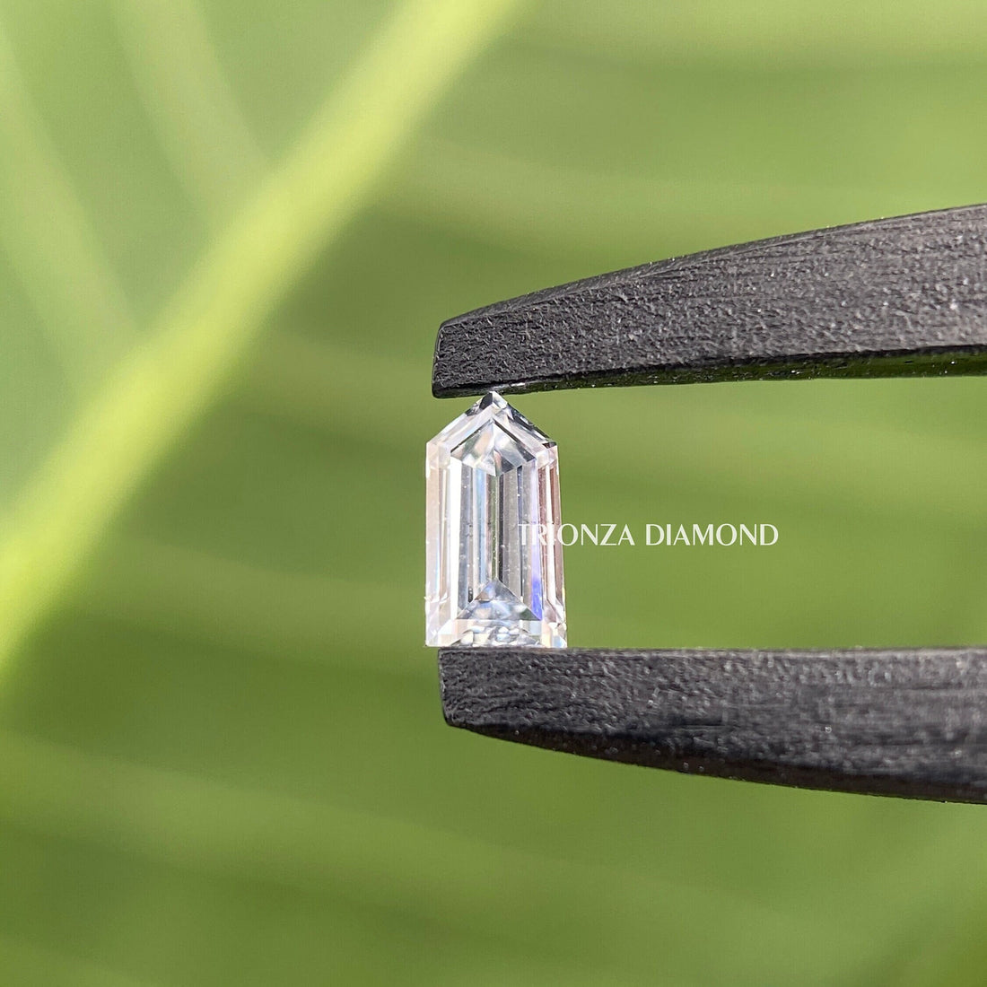 Bullet step cut lab grown diamond showcasing its unique elongated shape and clean facets