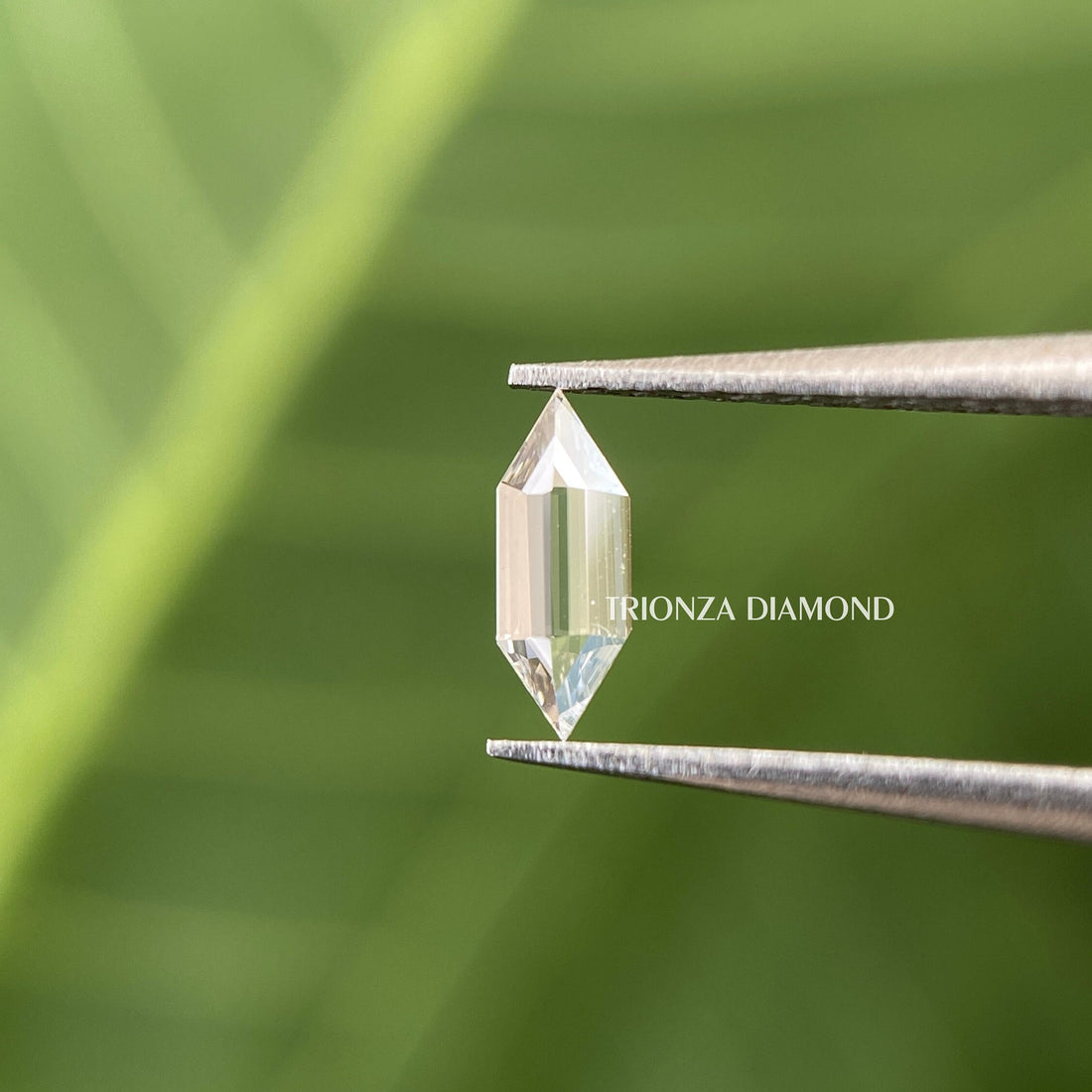 Hexagon step cut lab grown diamond displayed to highlight its fancy cut facets and clarity