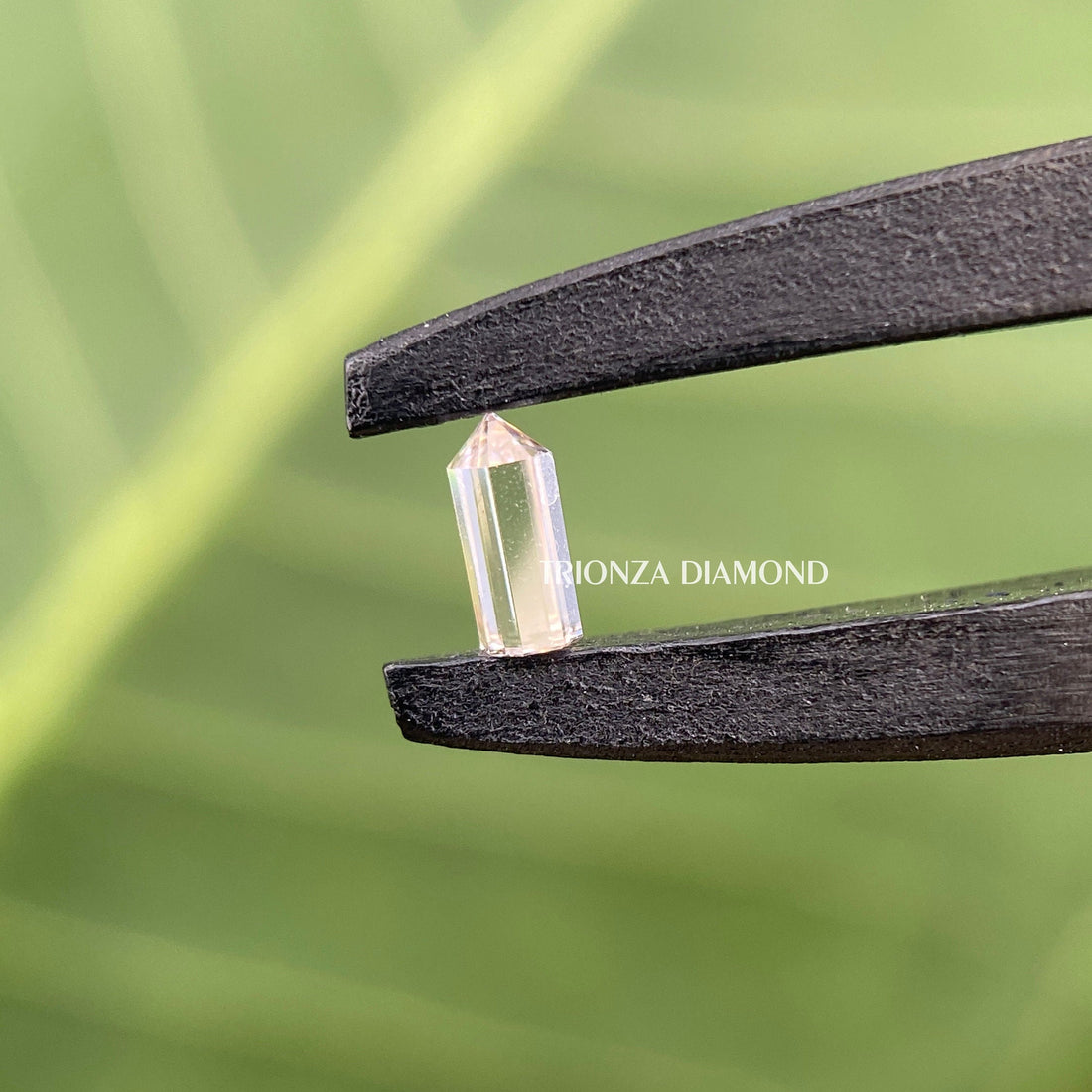 Bullet cut lab grown diamond displayed in pencil shape with F color and VS clarity