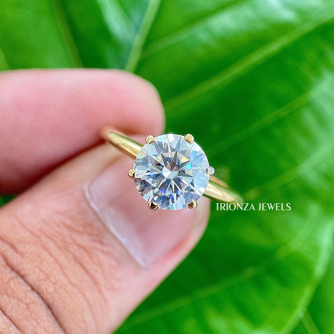 Round cut moissanite engagement ring crafted in 14k solid gold with six prongs