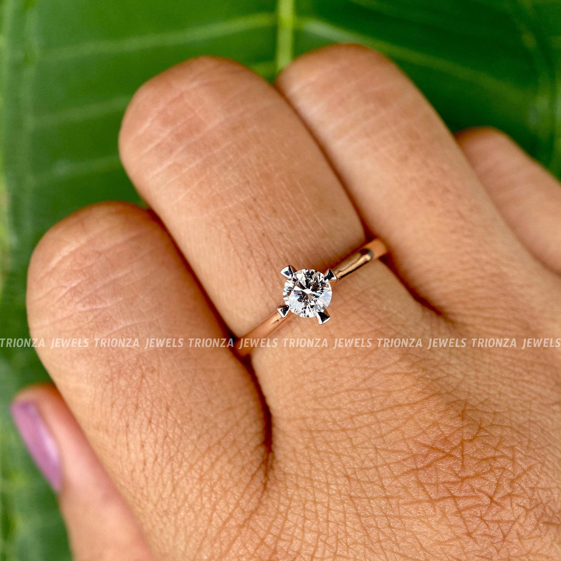 Round moissanite engagement ring in 14k solid gold with a 4-prong solitaire setting
