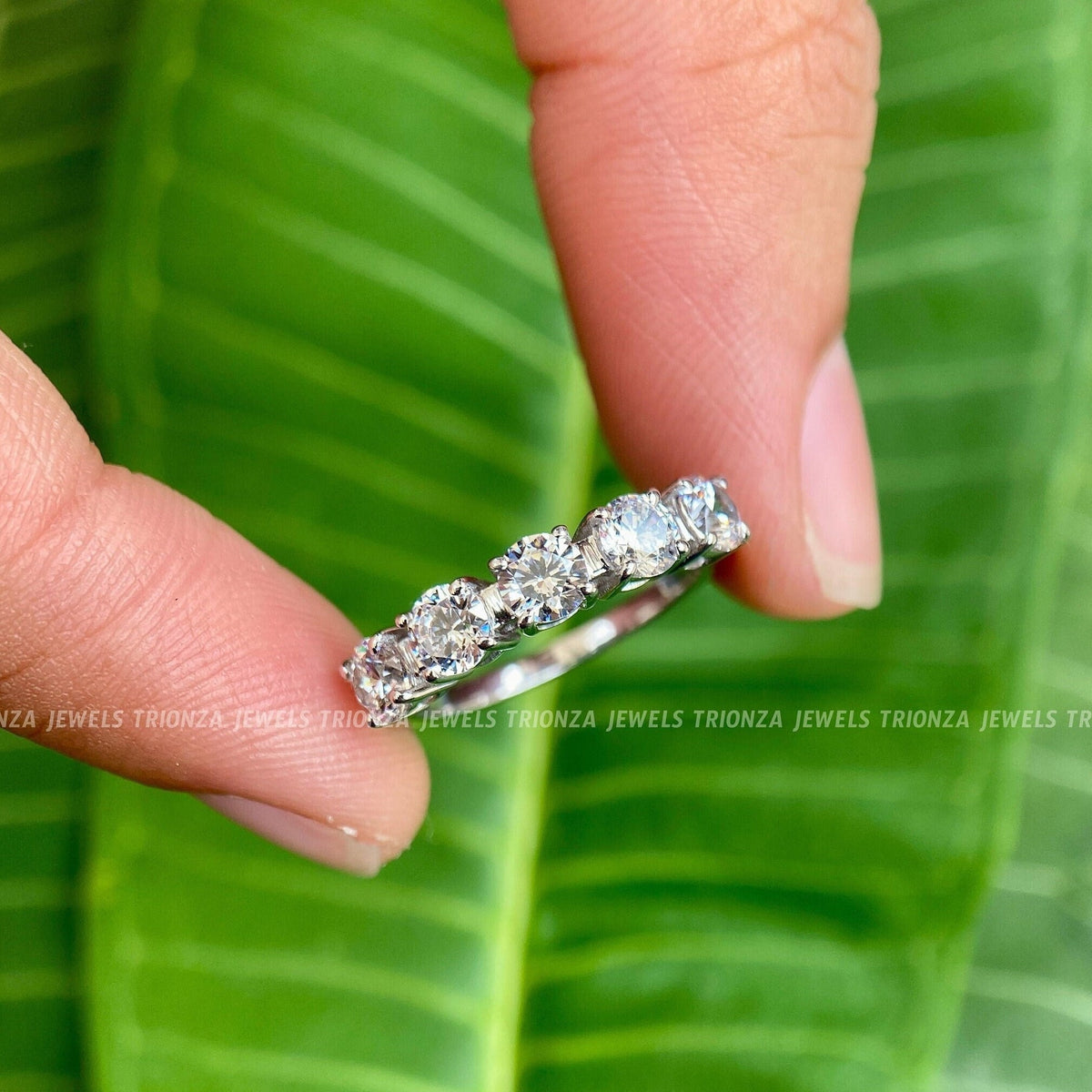 Round cut moissanite anniversary ring band featuring five stones set in white gold