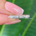TrionzaDiamond wedding band showcasing prong set moissanite stones with vintage inspired milgrain edges
