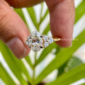 Woman wearing the oval moissanite engagement ring, close-up on her hand