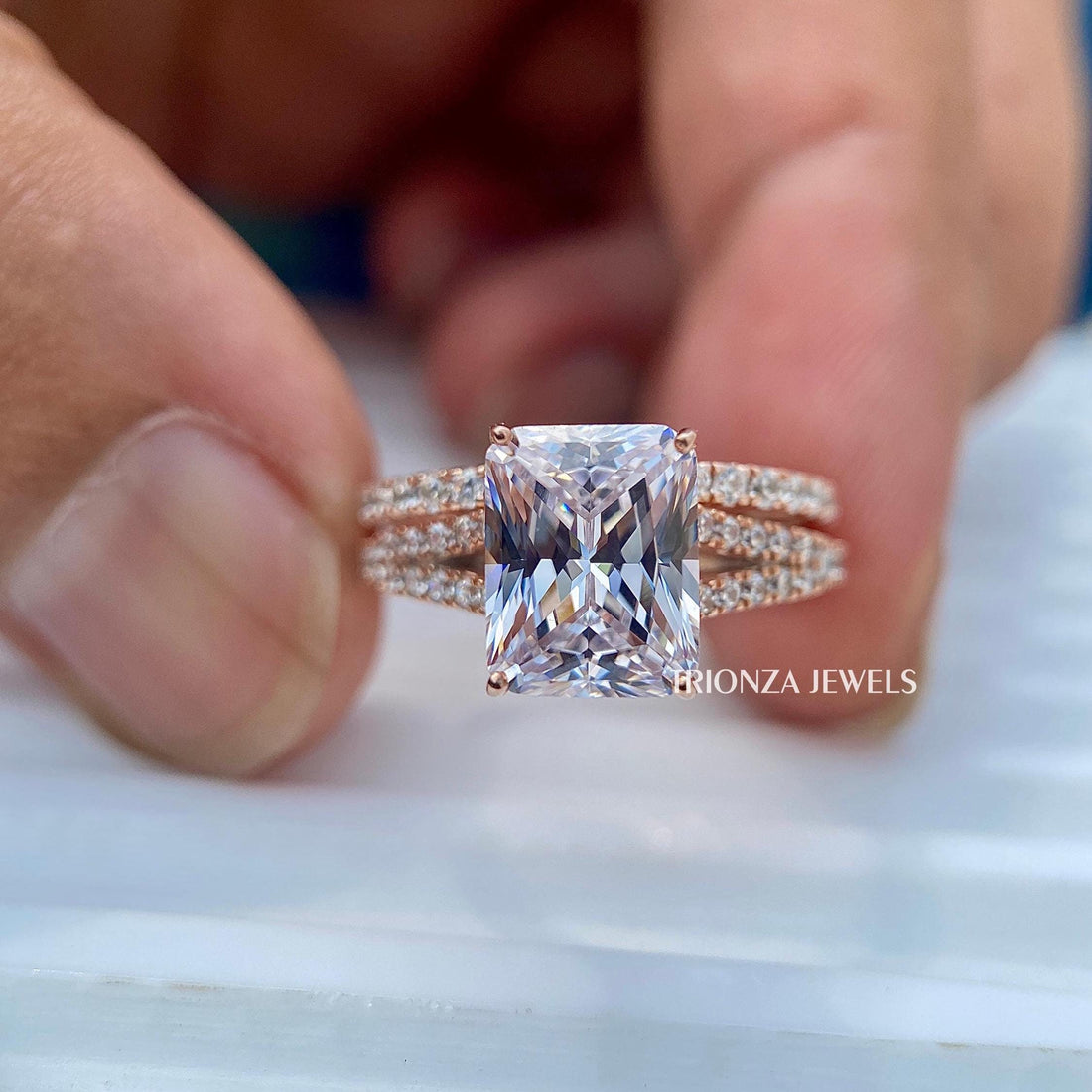 Radiant cut moissanite engagement ring paired with a thin rose gold eternity band bridal set