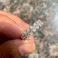 Side view of the oval cut lab grown diamond wedding band showing its stackable design