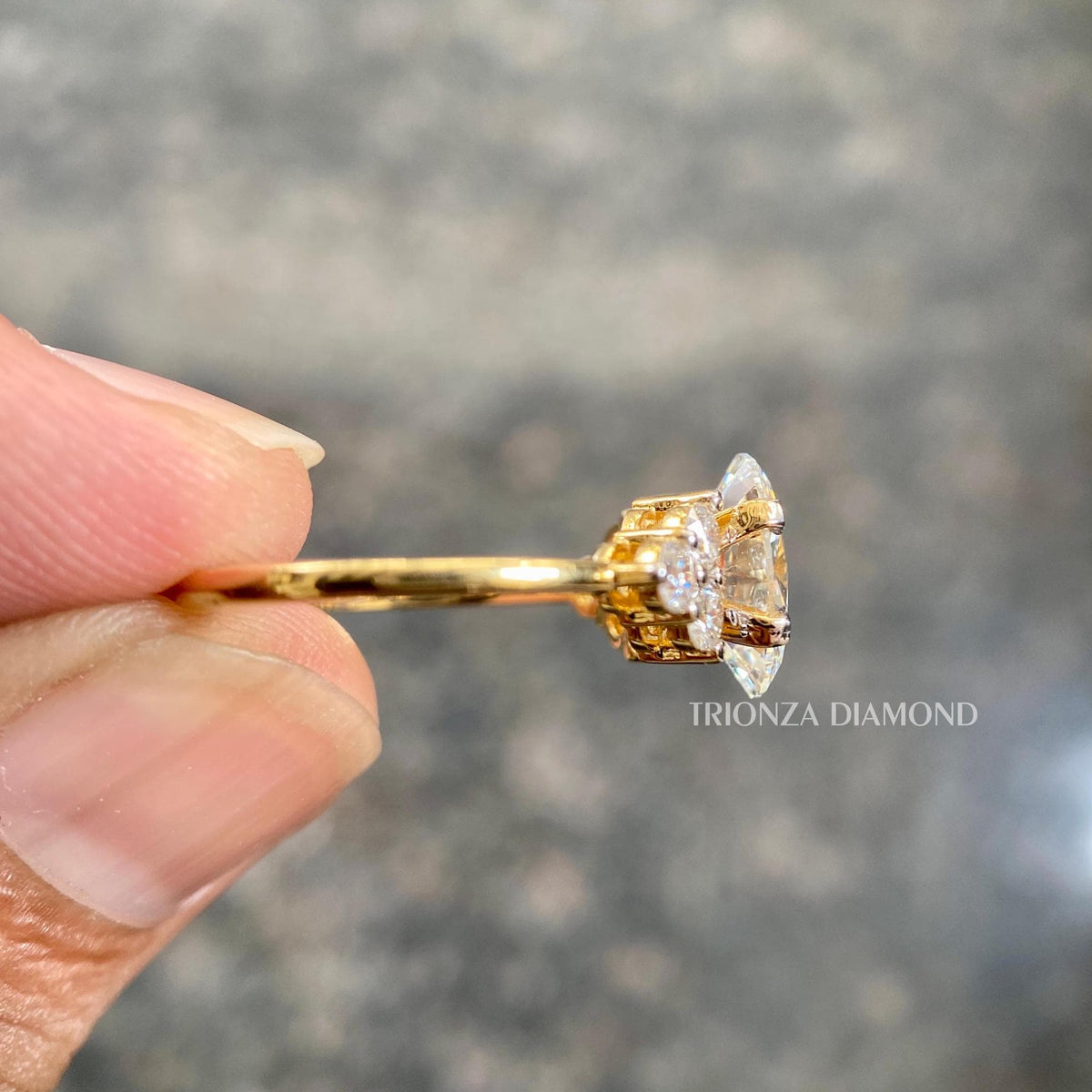 Handcrafted oval diamond ring photographed in natural sunlight to show true sparkle