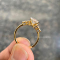 Close-up of the oval cut diamond highlighting its 12 x 8 mm measurement and clarity