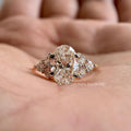 Round brilliant cut side diamonds accenting the oval center stone in this solitaire ring