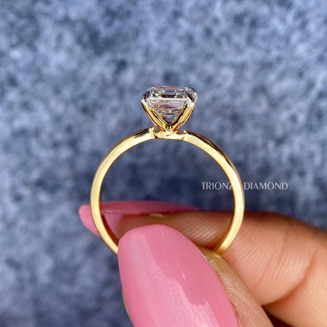 Asscher cut lab grown diamond engagement ring showcasing a D color VVS2 center stone