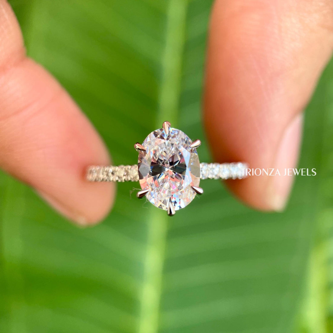 Oval moissanite solitaire engagement ring featuring a unique 6 prong handmade setting
