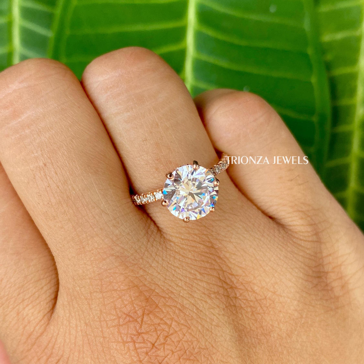 Handmade 14K gold engagement ring featuring VVS clarity round cut side stones