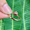 Moissanite engagement ring presented inside its jewelry box with smooth fabric