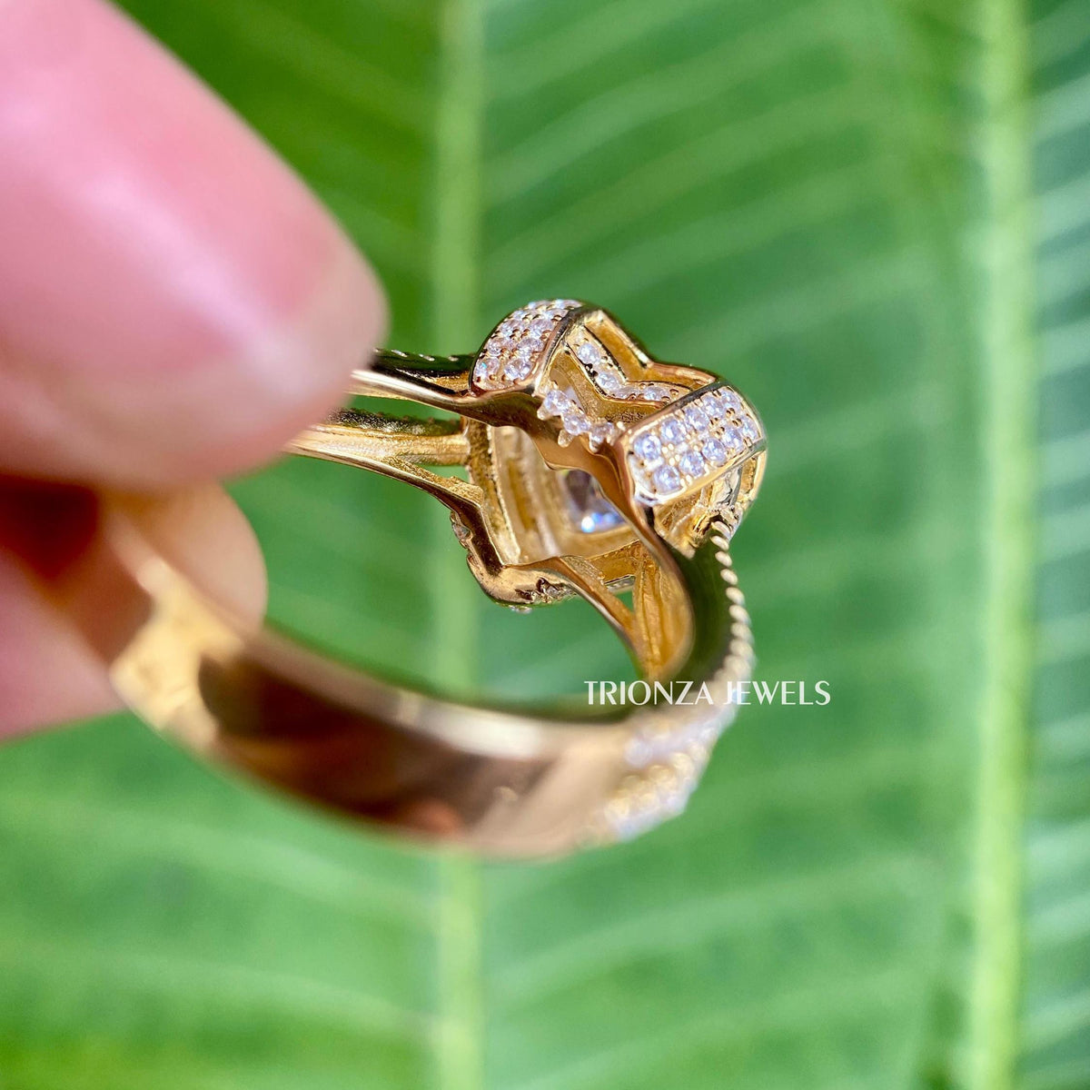 Prong and halo setting showcasing the heart cut moissanite and round side stones