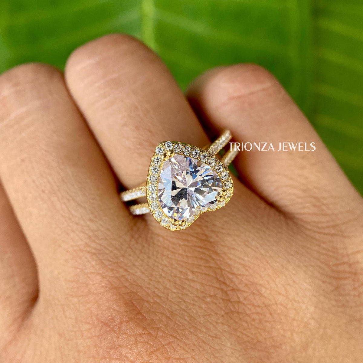 Round moissanite accent stones lining the band for added sparkle and brilliance