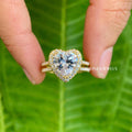 Vintage heart cut moissanite engagement ring featuring a striking double halo design