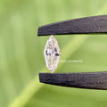 IGI certified 0.55 carat marquise diamond set against a soft background for detail viewing