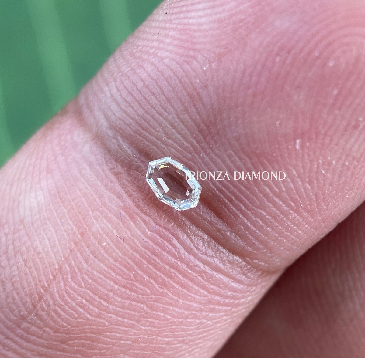 Loose oval shape diamond measuring 4.5 by 3.5 MM shown from a side angle