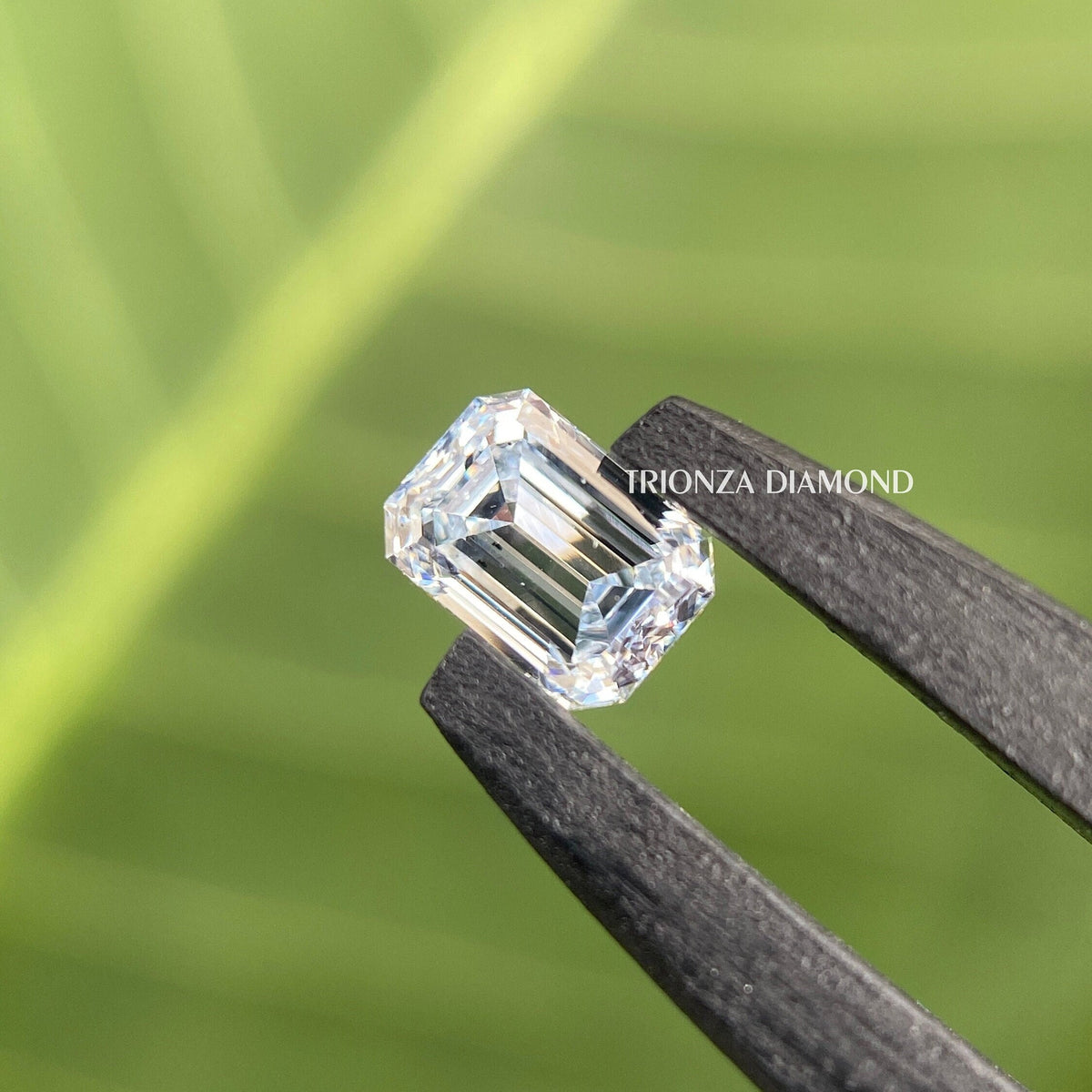 Intense blue radiant cut lab grown diamond displayed as a loose stone for custom jewelry
