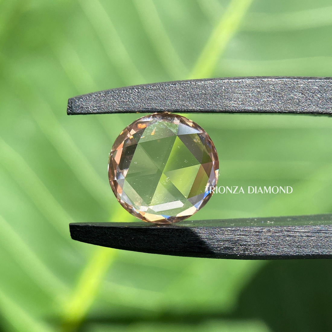 Round rose cut lab grown diamond displaying its intense brown color and vintage cut facets