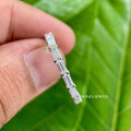 Close-up of the 1.02 CT baguette cut colorless moissanite stones set in the band