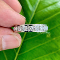 Full eternity stackable ring displayed to show its continuous channel setting