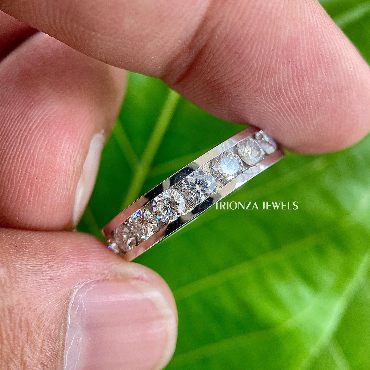 Close-up of the round cut colorless moissanite stones measuring 3mm each