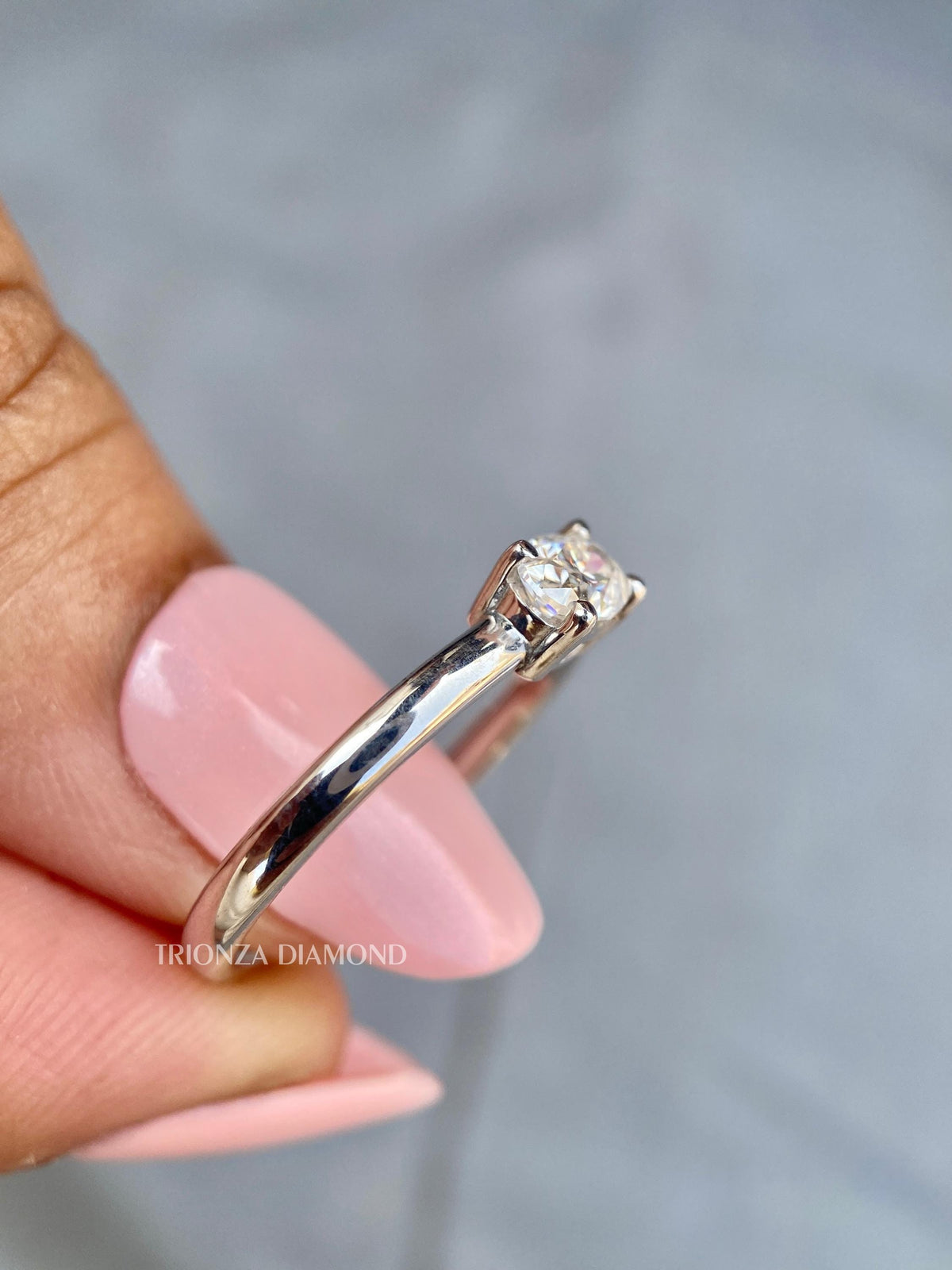 Woman wearing the oval lab grown diamond ring as an everyday promise ring