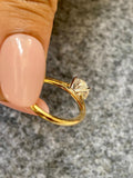 Woman wearing the round diamond solitaire ring, close-up on her hand
