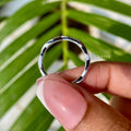 Handmade moissanite eternity band crafted with prong settings for a secure and elegant look