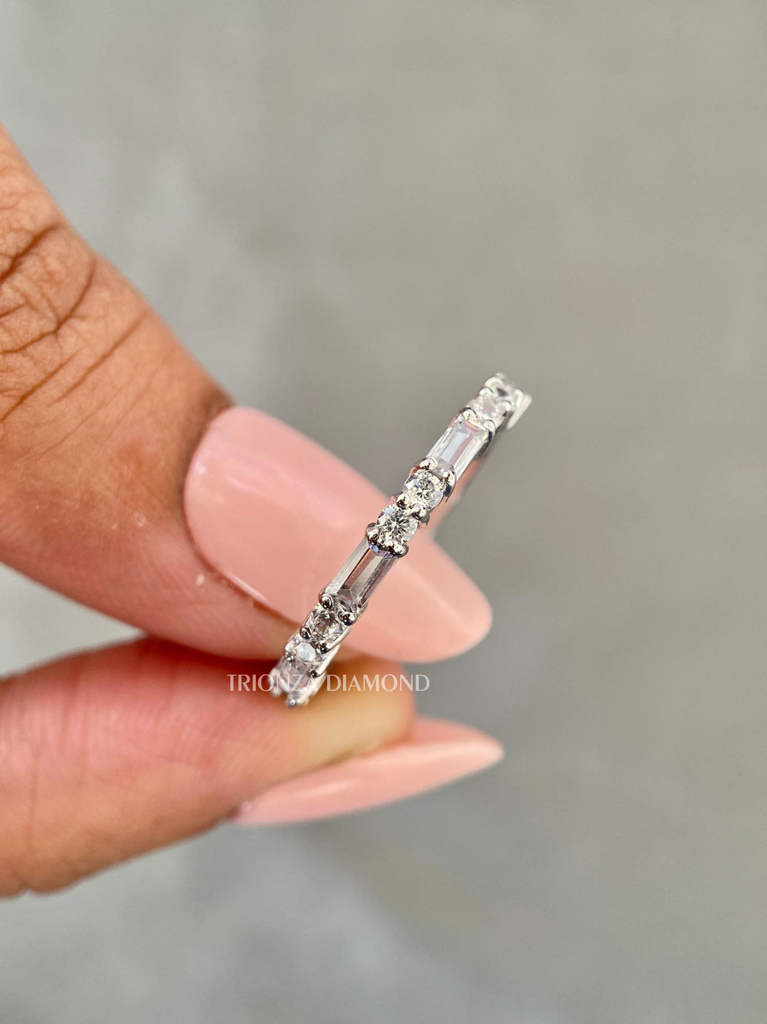 Baguette round half eternity band showcasing sparkle and structure in a handcrafted design