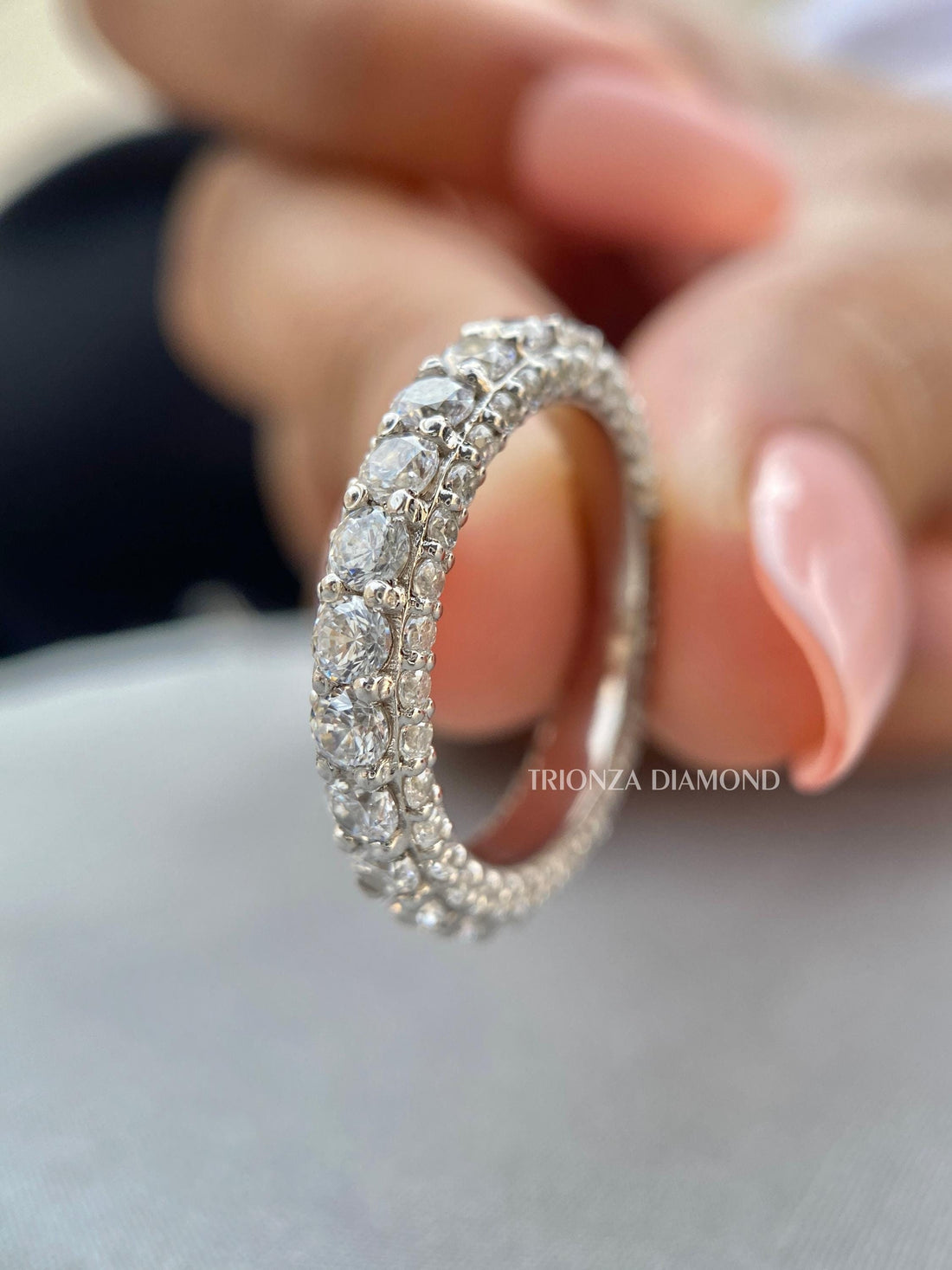 Round lab grown diamond eternity band in 14k white gold with chunky 3-sided pave setting