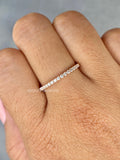 Tiny diamond eternity ring shown with its delicate thin ball band details