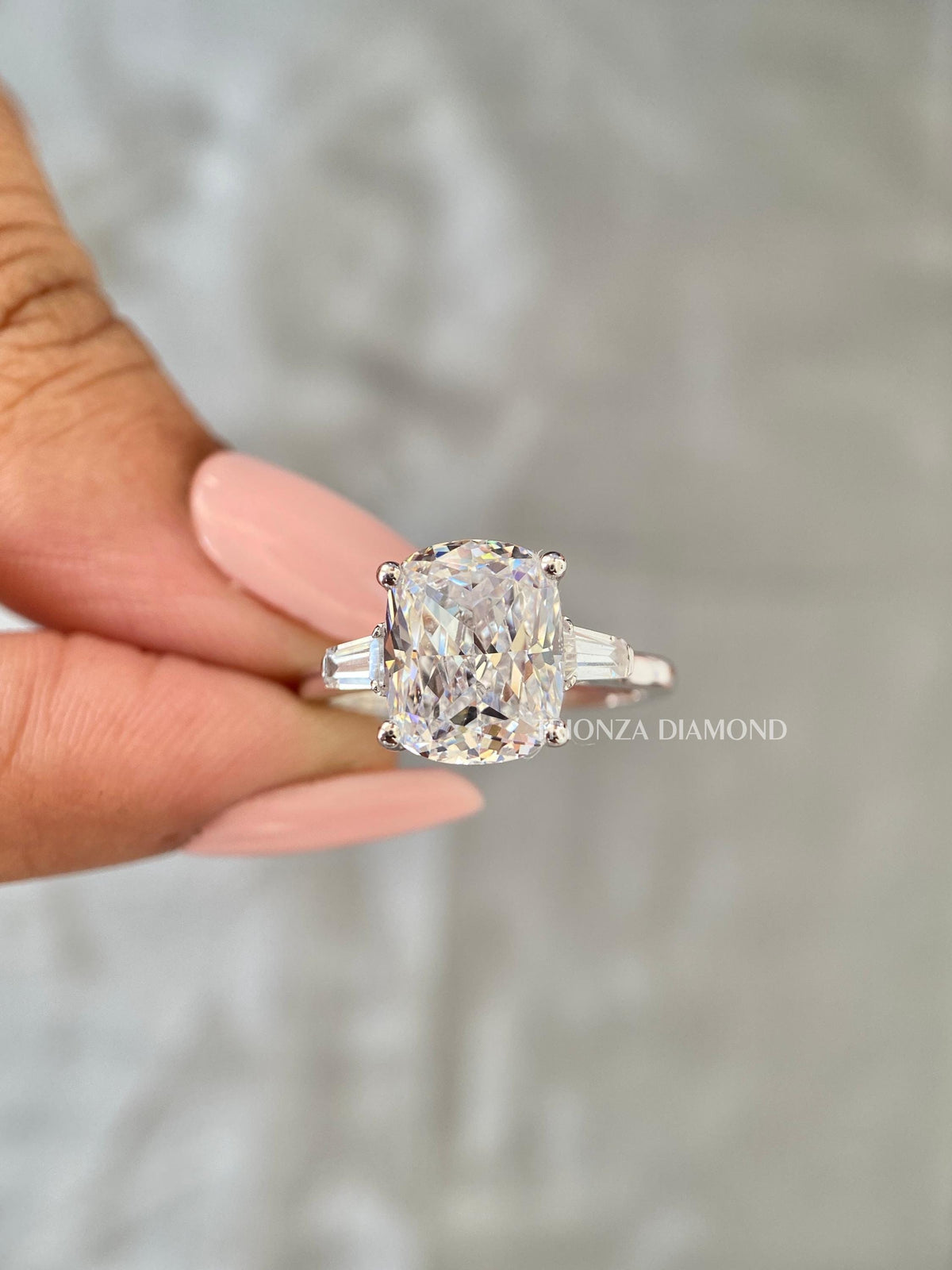 Cushion cut engagement ring displayed to highlight the excellent polish and symmetry of the diamonds