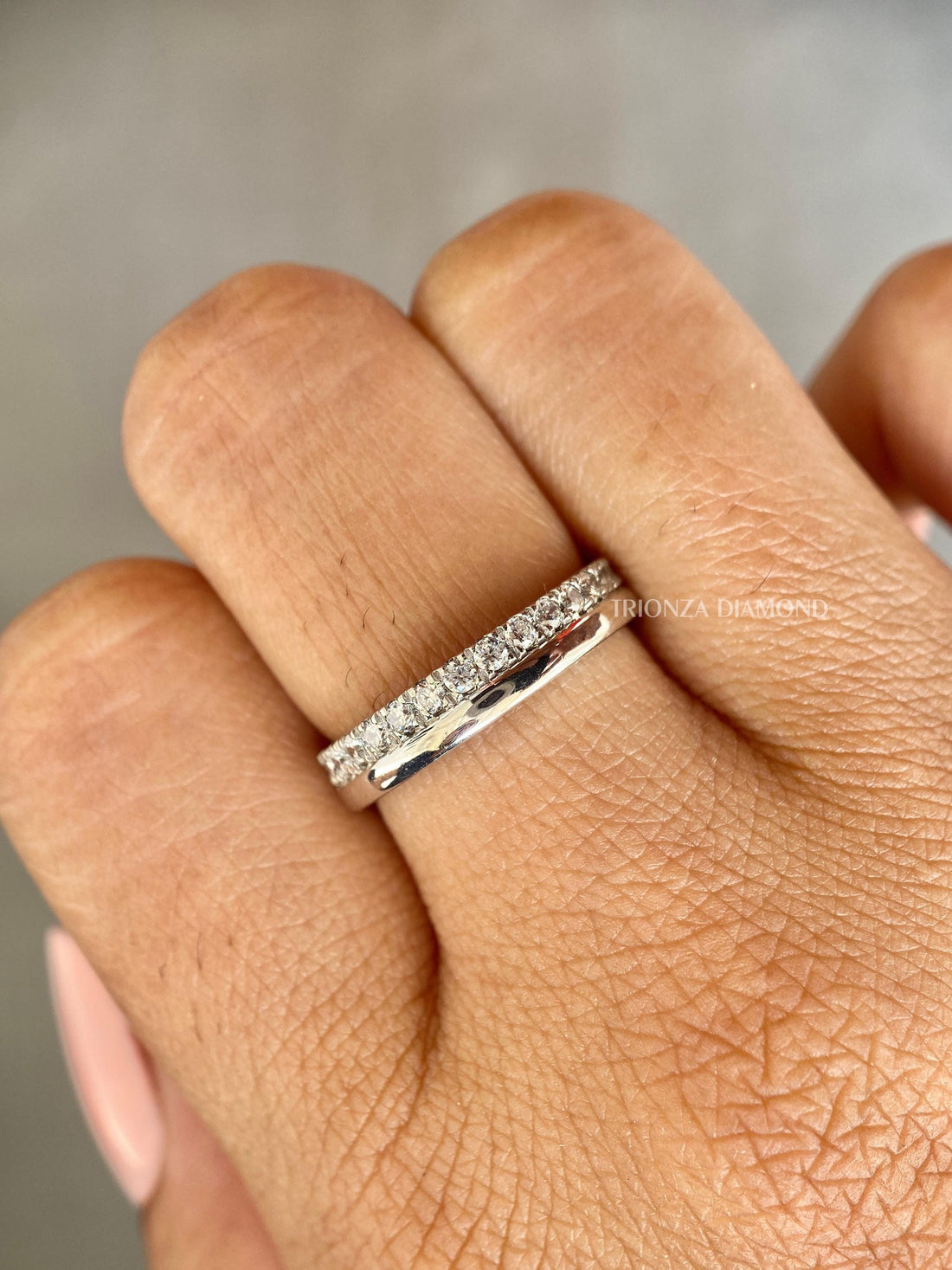 Double row lab grown diamond wedding band featuring round cut micro pave diamonds