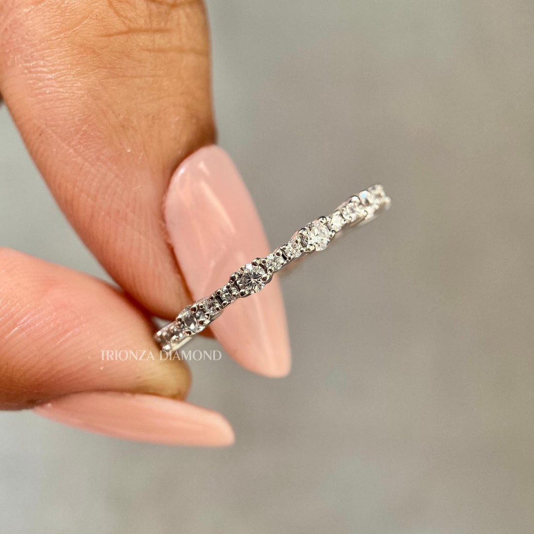 Round cut lab diamond full eternity band crafted in platinum for continuous sparkle