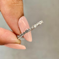 Round cut lab diamond full eternity band crafted in platinum for continuous sparkle