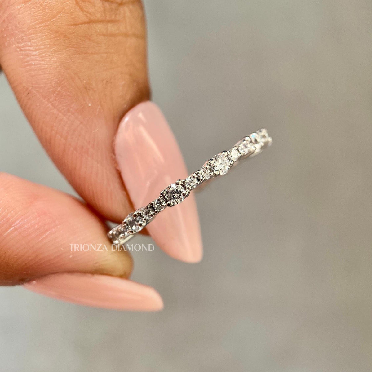 Round cut lab diamond full eternity band crafted in platinum for continuous sparkle