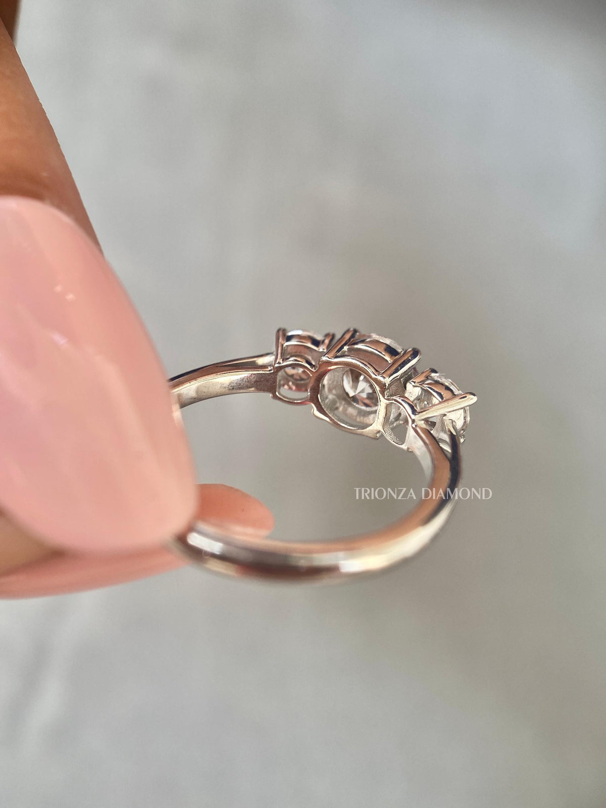TrionzaDiamond anniversary band displayed in its jewelry box with smooth fabric