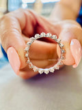 Close-up of the 2.5MM round diamonds set around the full eternity wedding band