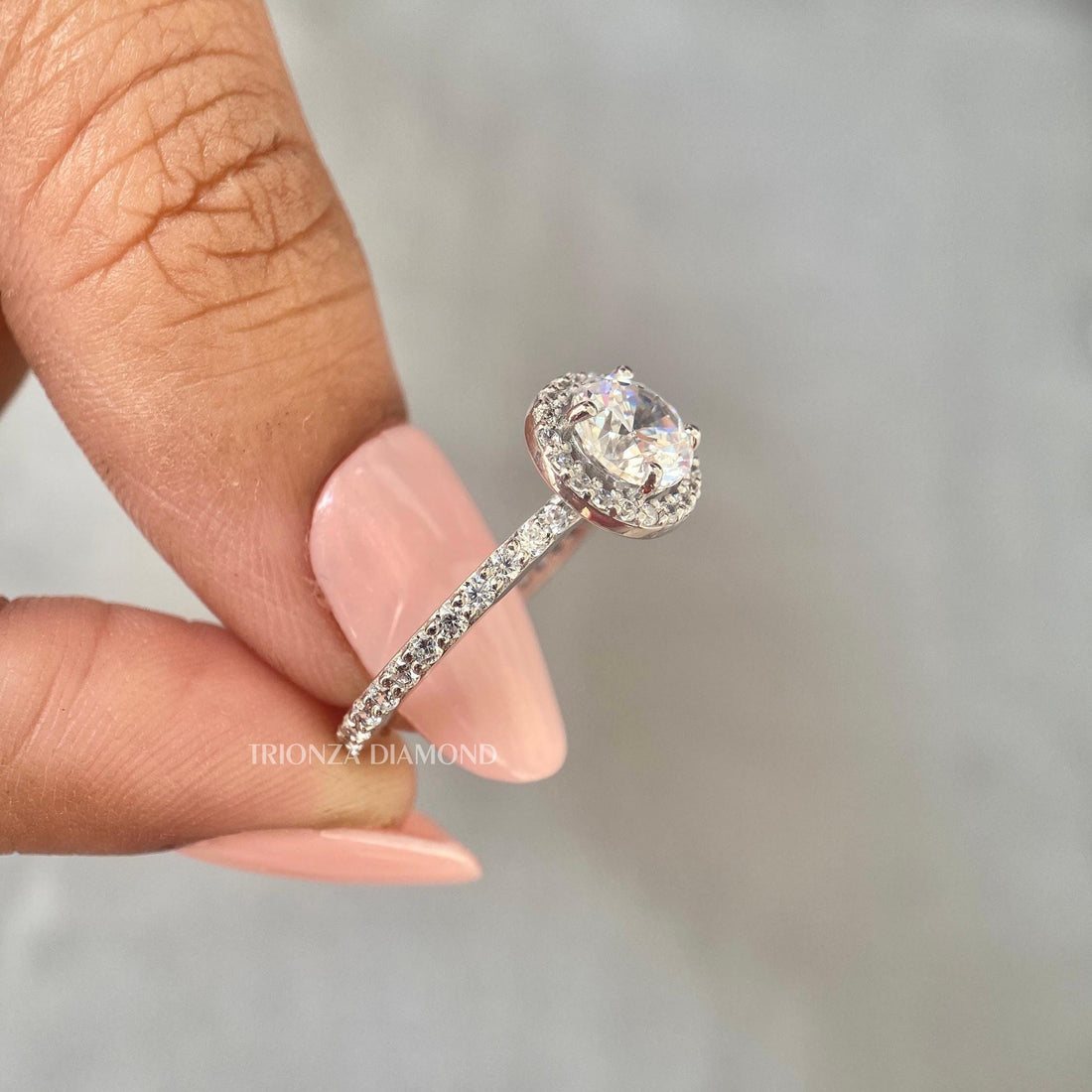 Round brilliant lab grown diamond halo engagement ring with vintage inspired detailing