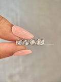 Close-up of the 3.0 mm round diamonds set securely in a bezel setting