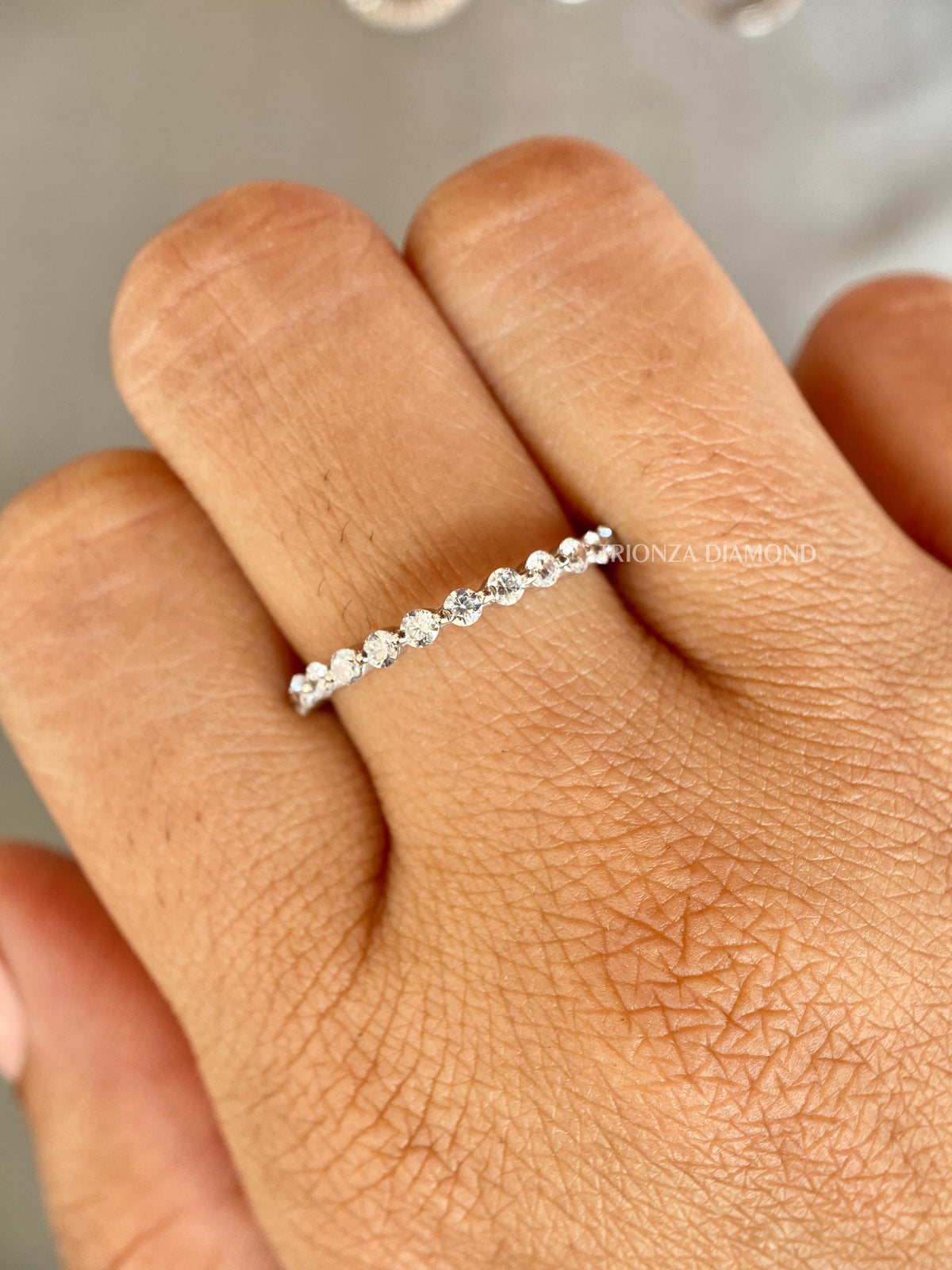 Half eternity diamond band designed as a matching band for an engagement ring