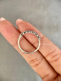 Close-up of the stackable wedding band showing the D/E color VVS/VS clarity diamonds