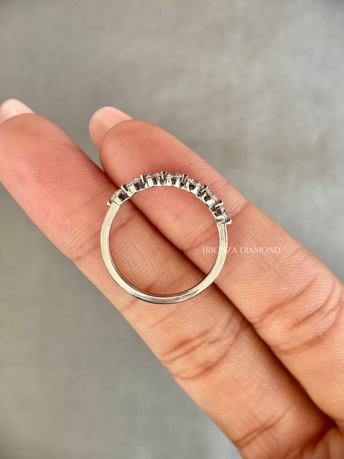 Close-up of the stackable wedding band showing the D/E color VVS/VS clarity diamonds