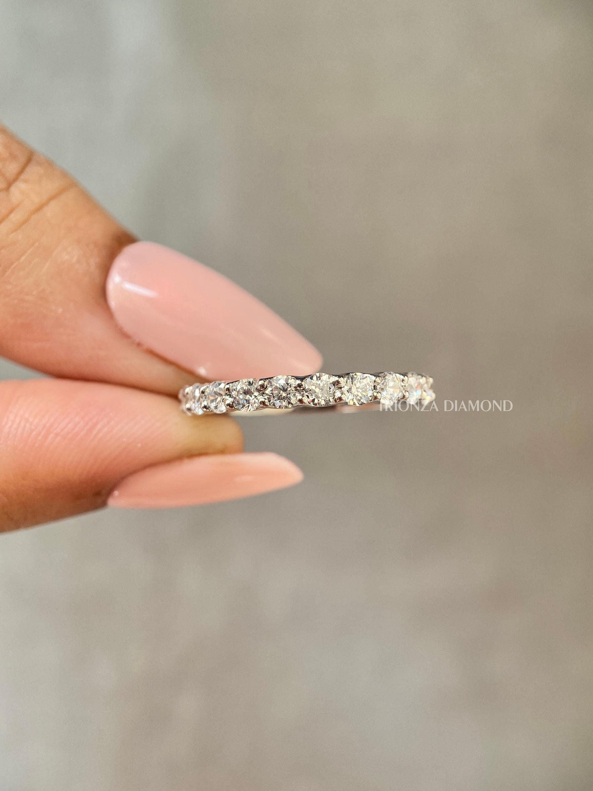 Close-up of the 2.00 mm round diamonds pave set along the half eternity band