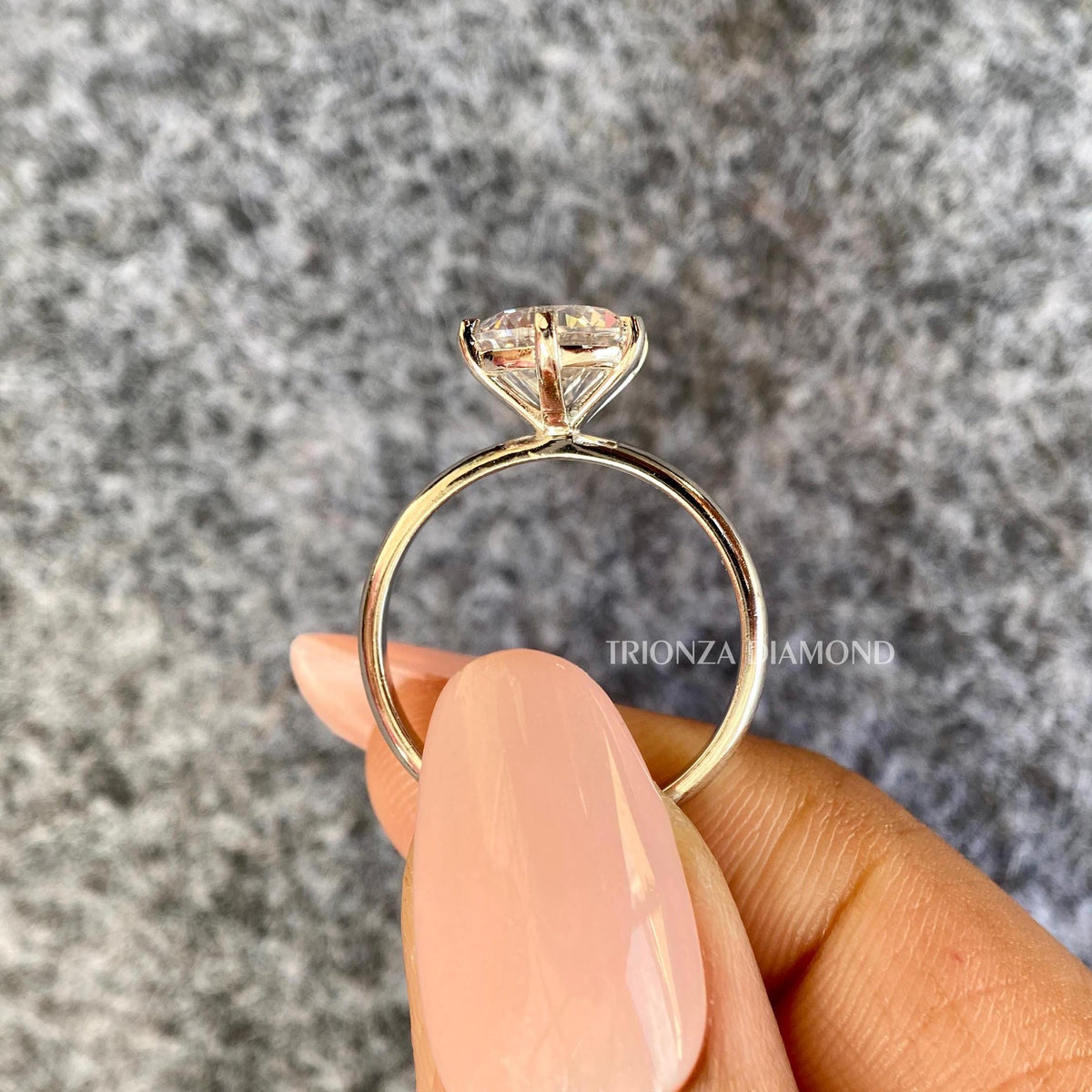 Close-up of the 2 CT round cut diamond showing its E color and VVS2 clarity