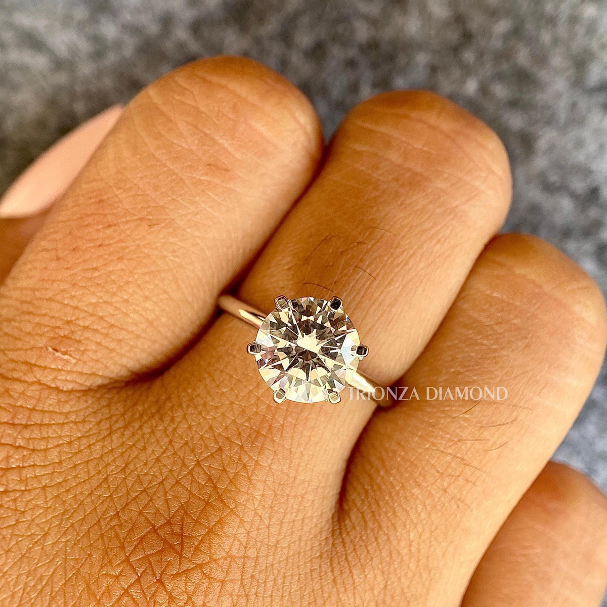 6-prong solitaire ring designed to hold the round diamond securely and elegantly