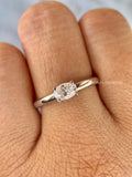 Close-up of the oval cut D color VVS2 diamond set in a minimalist band