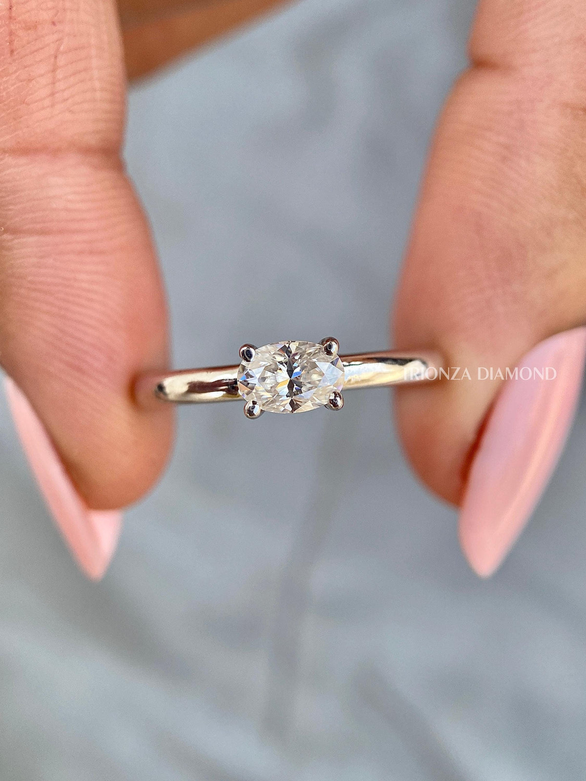 East west oval lab grown diamond ring displayed as a solitaire engagement ring design